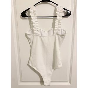 White ruffle sleeve body suit
